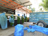 a truck with blue tarps
