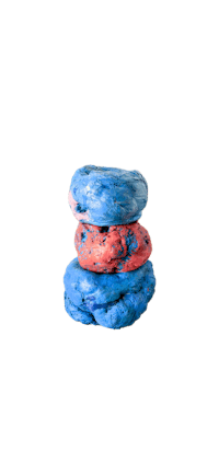 a stack of blue and red doughnuts on a black background