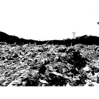 a black and white photo of a pile of garbage
