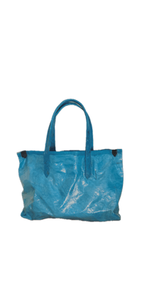a blue tote bag on a black background